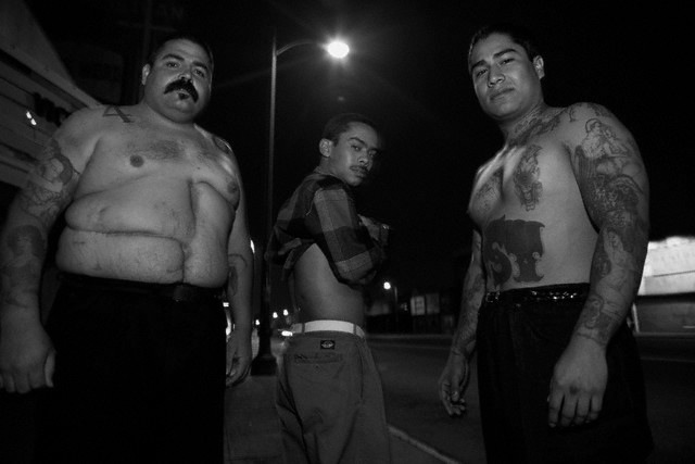 Circa 1993– South Central LA 40th Street Gang members show off scars from 
