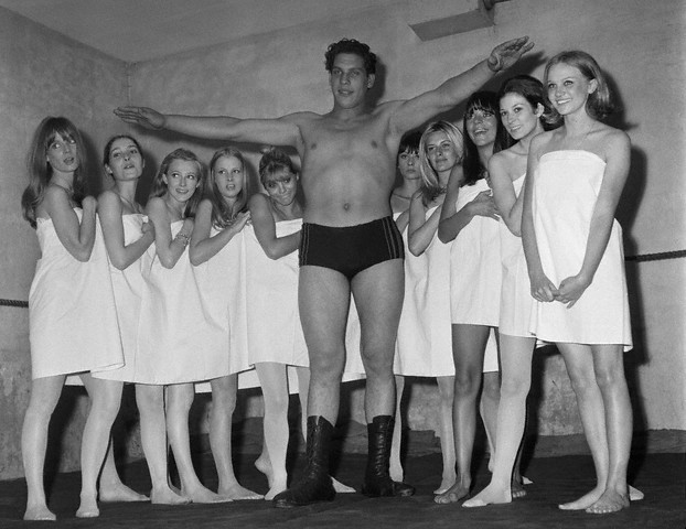 French wrestler Andre Rene Roussimoff, best known as "Andre the Giant" during a Paris fashion exhibition. At 19, Andre reportedly stands 7 feet and 4 inches tall  --1966.
