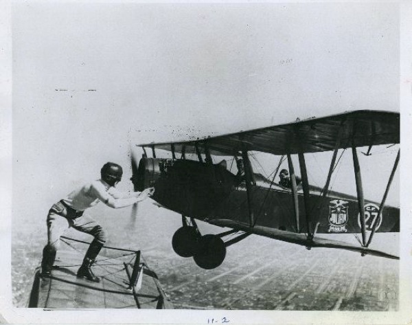 Gladys Ingle transferring from Bob McDougall's airplane to Art Goebel's